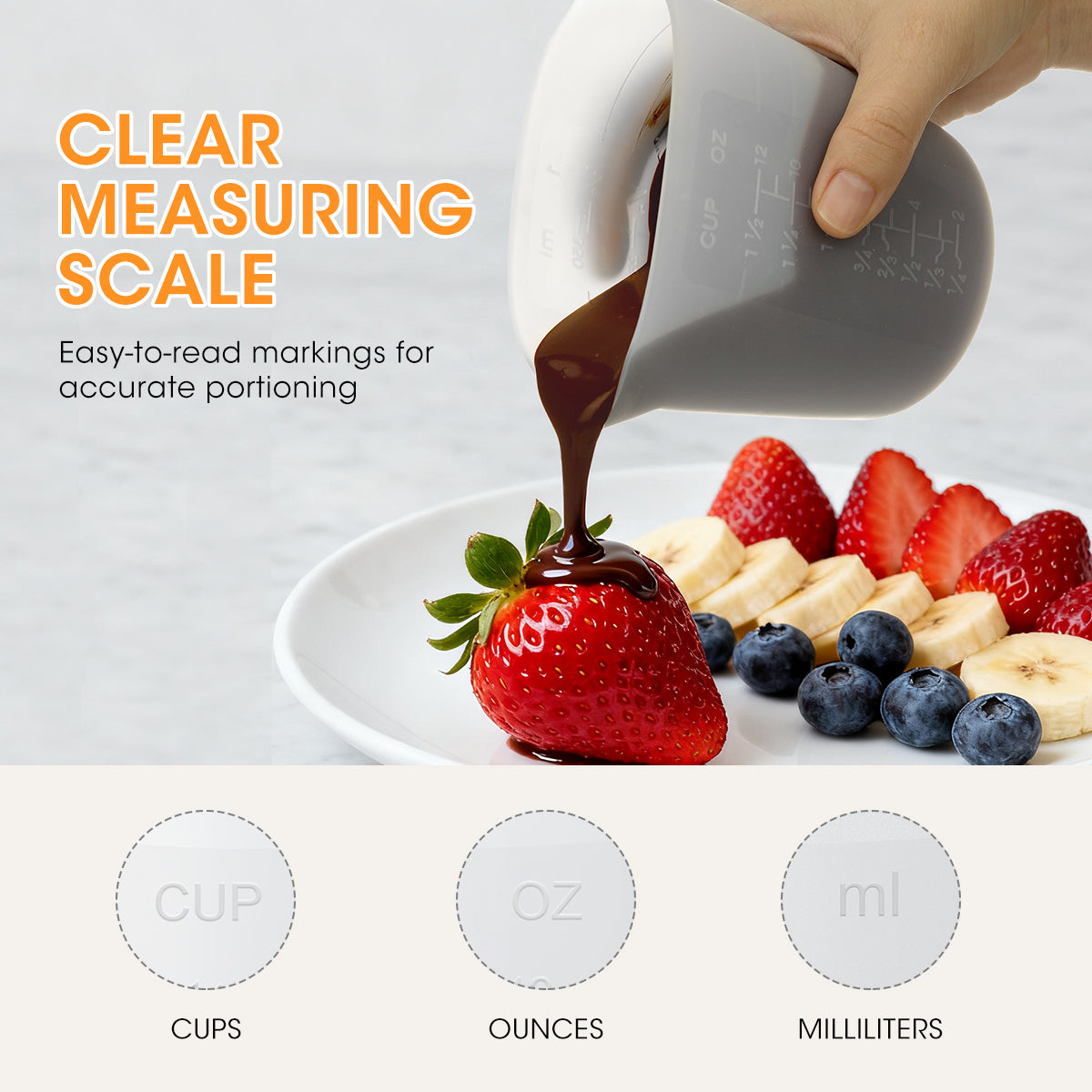 Measuring jug pouring chocolate sauce onto a strawberry with clear measuring scale text and fruit on a white background.