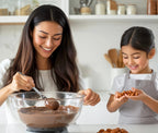 Woman and child in a kitchen making chocolate truffles